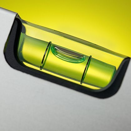 detail of spirit level with spot light on background