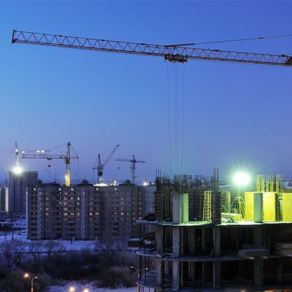 high-rise building under construction against blue sky